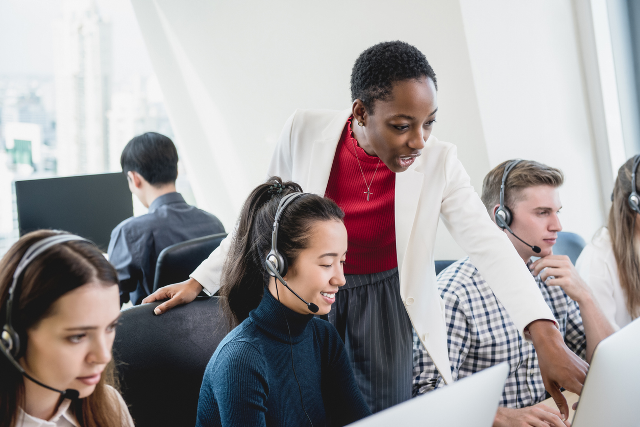 Female supervisor training call center team